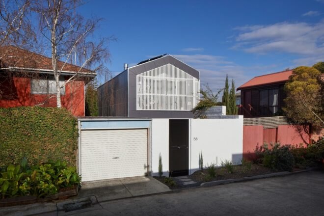 home design with pitched roof and silver and white exterior