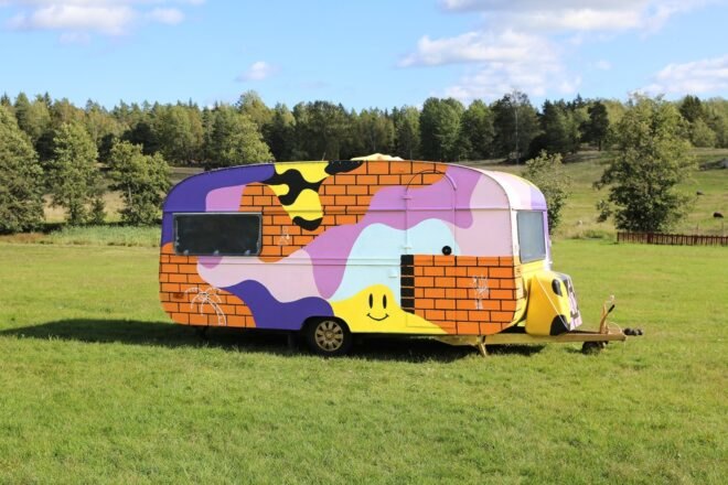 a campervan with multi-colored exterior
