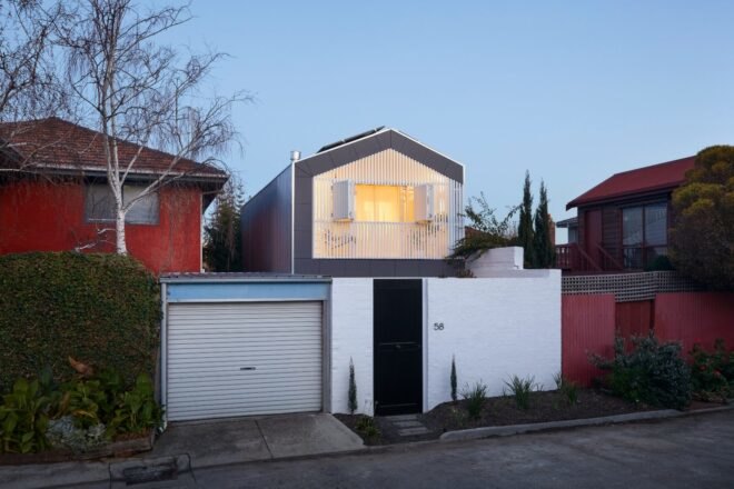 tall white home with gabled roof