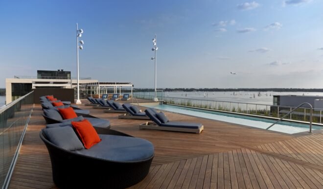 blue lounge chairs on a wood deck