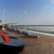 blue lounge chairs on a wood deck
