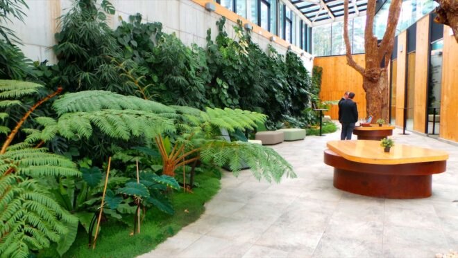 bright orange tables and brown seats in covered courtyard