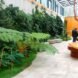 bright orange tables and brown seats in covered courtyard