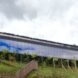long building with glass walls on a hill
