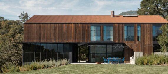 elongated two-story home clad in wood
