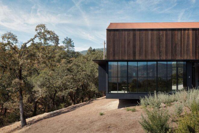 home with glass-enclosed ground floor