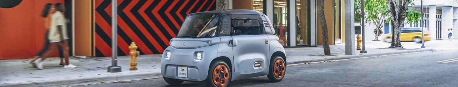 gray electric car on a city street