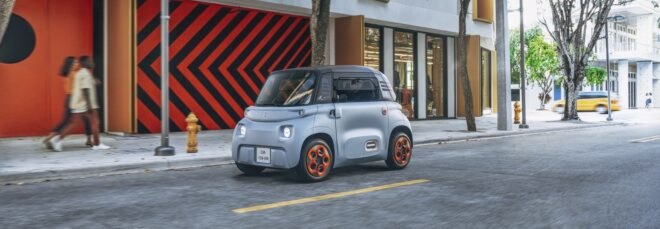 gray electric car on a city street