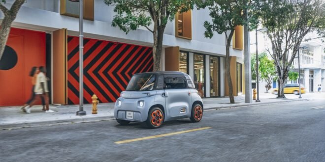 gray electric car on a city street