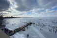 people walking on a frozen lake