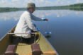 person in boat monitoring lake pollution