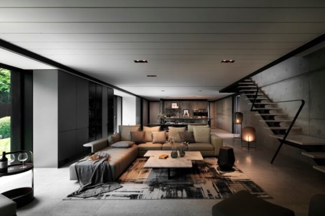 leather sectional in a room with concrete walls
