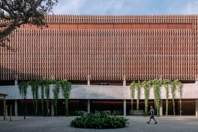 wood and concrete hotel building elevated on stilts
