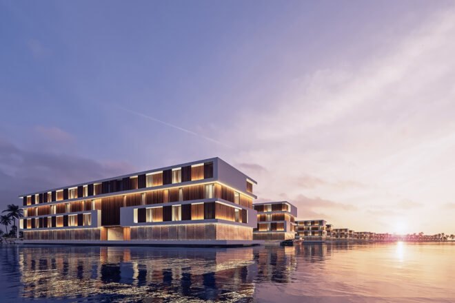 a long rectangular floating hotel lit up at sunset