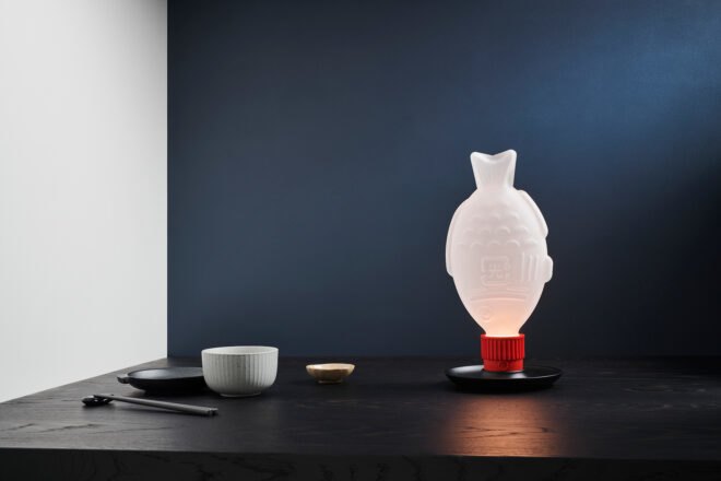 fish-shaped lamp on dark table