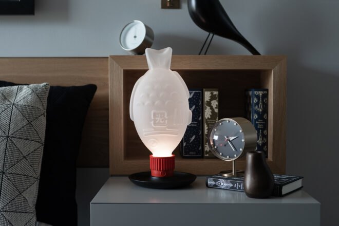 fish-shaped lamp on a nightstand