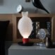 fish-shaped lamp on a nightstand