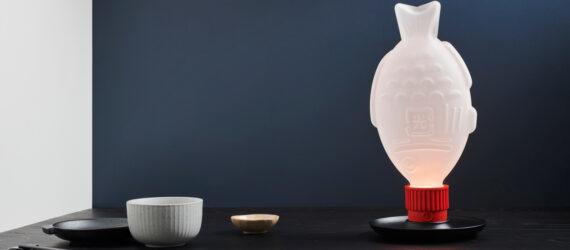 fish-shaped lamp on dark table
