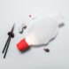white and red fish-shaped lamp near fish-shaped soy sauce packet and sushi