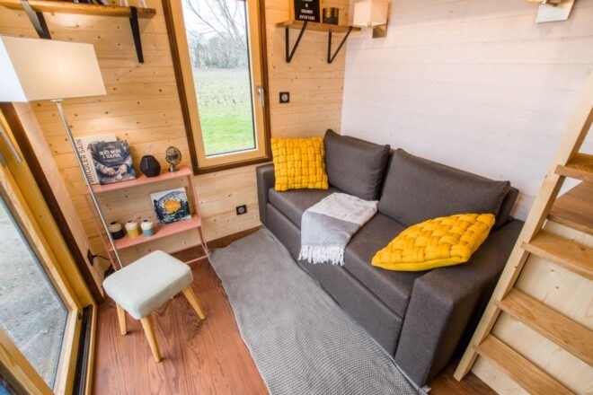 grey sofa with yellow pillows