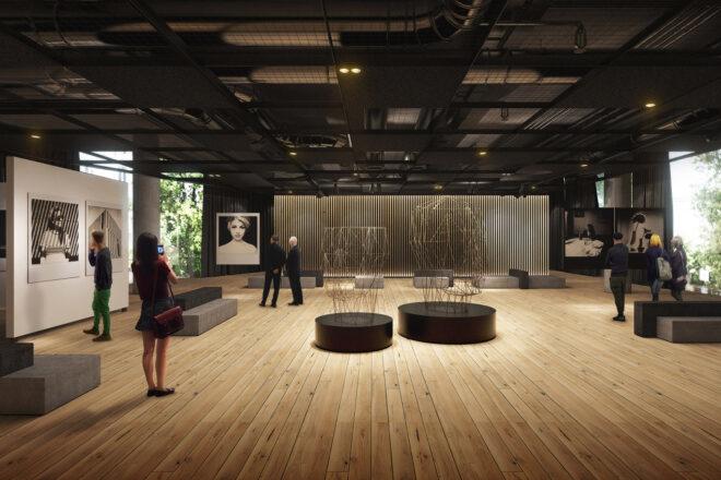 a room with art and light-colored wood floors