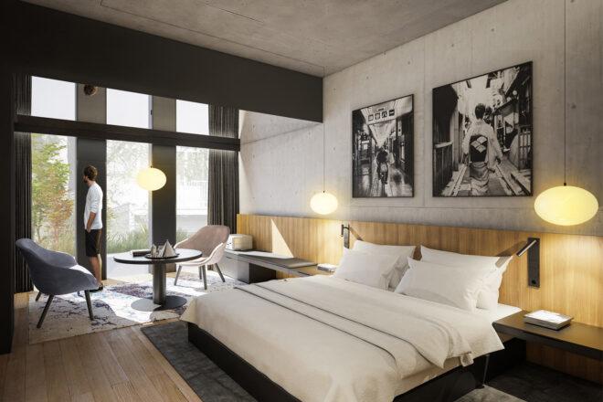 a bedroom in a hotel with three windows and art on the wall