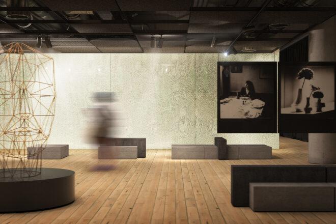 long exposure shot of a person exploring a room filled with art