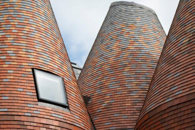 conical structures clad in red brick