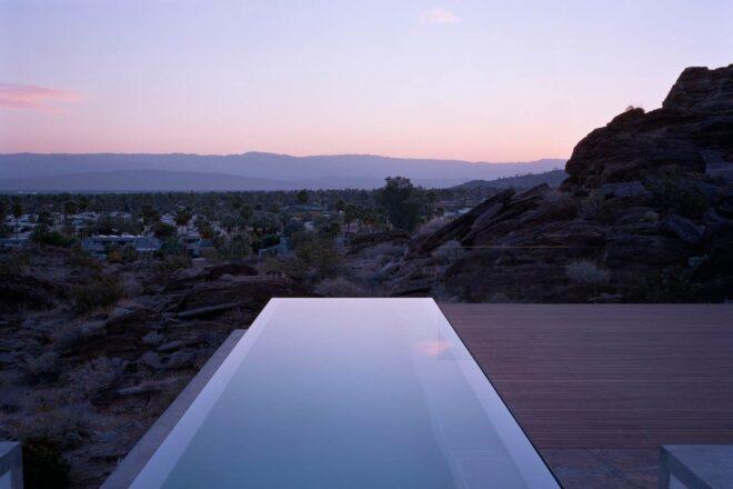 infinity pool looking out over the desert at dusk