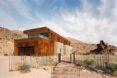 two-story home with second story clad in weathered steel