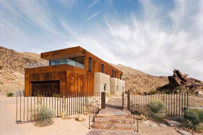 two-story home with second story clad in weathered steel