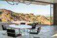 round dining table with seating looking out over hilly landscape