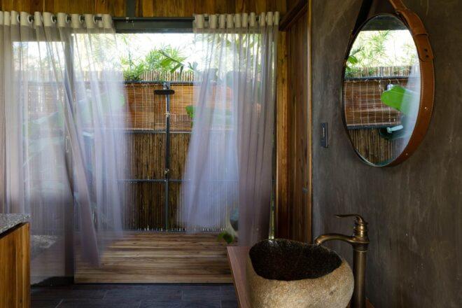 outdoor shower in rustic bungalow