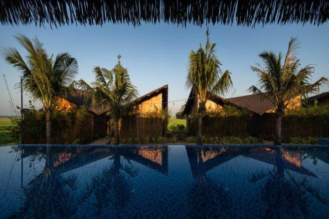 pool in foreground with bungalows in background