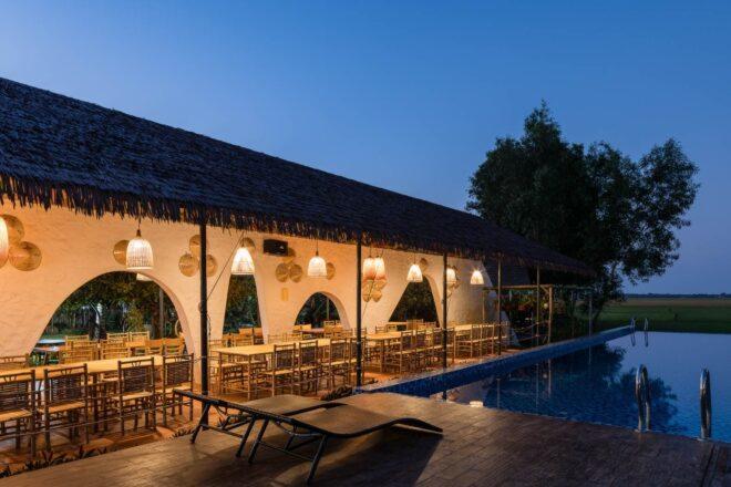 open-air restaurant next to swimming pool