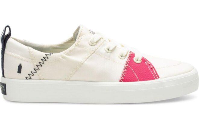 white tennis shoe with pink accents
