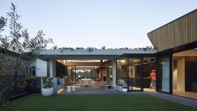 grass yard next to covered outdoor dining patio
