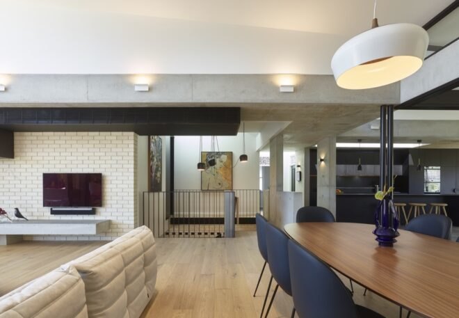 wood dining table near a white sectional sofa