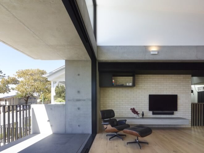 black leather seat near a wall open to the outdoors