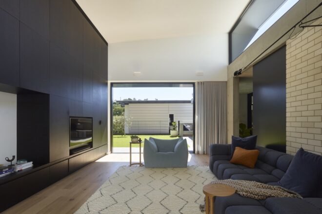 gray sofa facing a fireplace