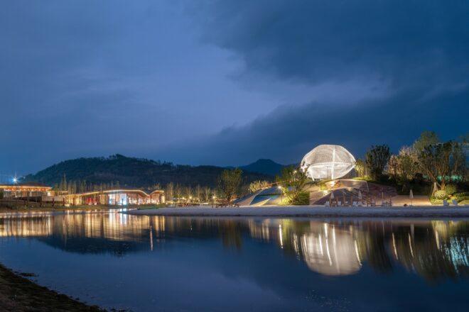 glowing white pavilion near water
