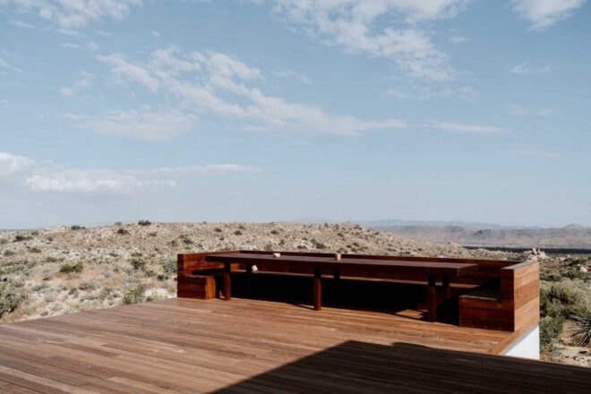 wooden deck overlooking desert landscape