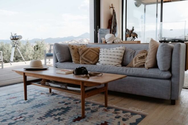 large sofa in front of glass wall