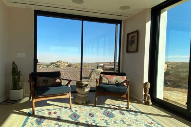 two chairs in front of glass doors