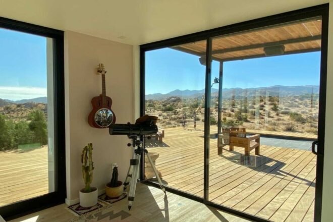 sliding glass doors leading out to wooden deck