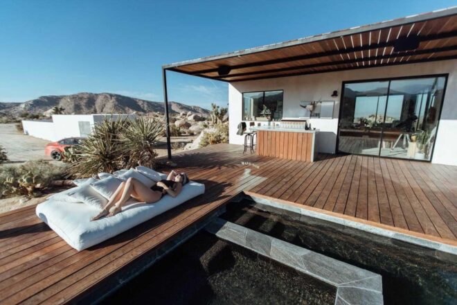 outdoor deck with pool and jacuzzi