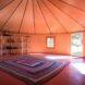 round living space with large square rug