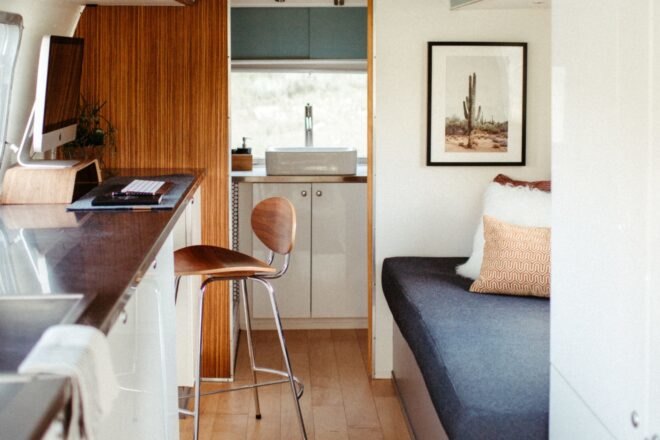 bench seating and a countertop inside an airstream trailer