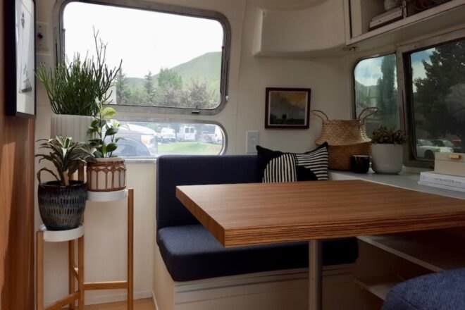 interior dining nook with bench seating and a table