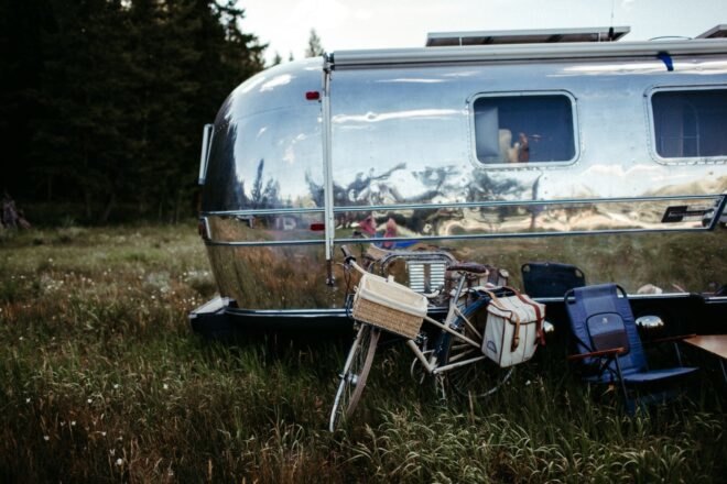 back view of airstream trailer with a bike next to it